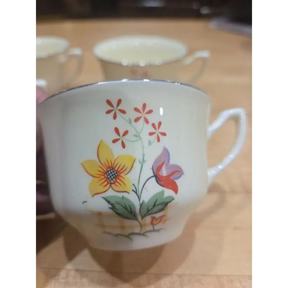 Set of 4 Vintage Porcelain Floral Teacups Yellow Purple Flowers Silver Rim